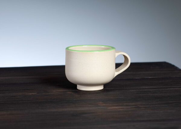 front view of espresso cup with green rim