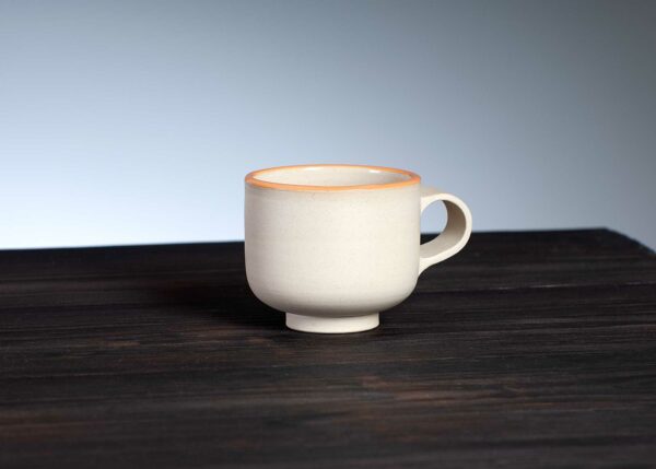 front view of espresso cup with orange rim