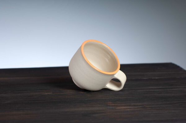 top view of espresso cup with orange rim