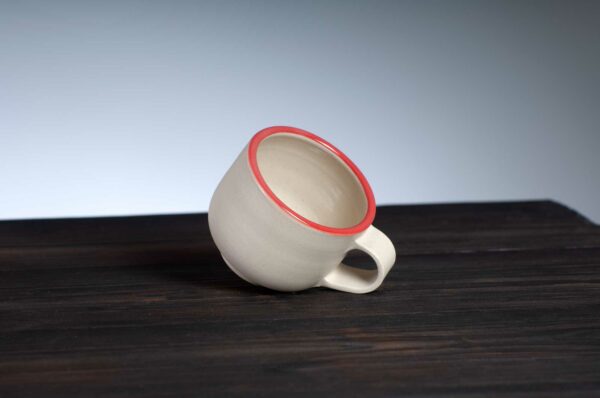 top view of espresso cup with red rim