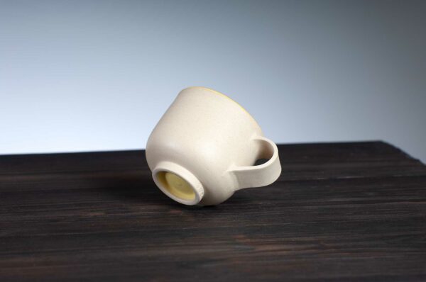 bottom view of espresso cup with yellow rim