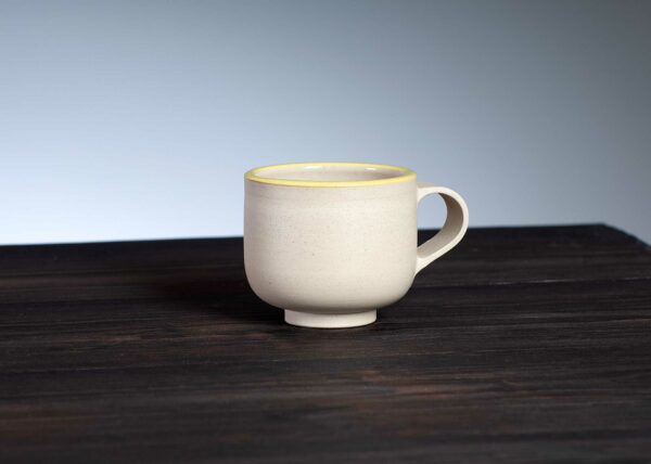 front view of espresso cup with yellow rim