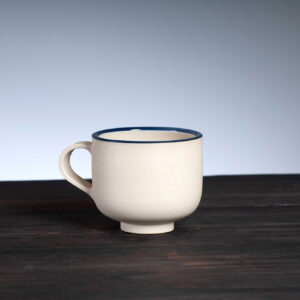 front view of coffee cup with navy rim