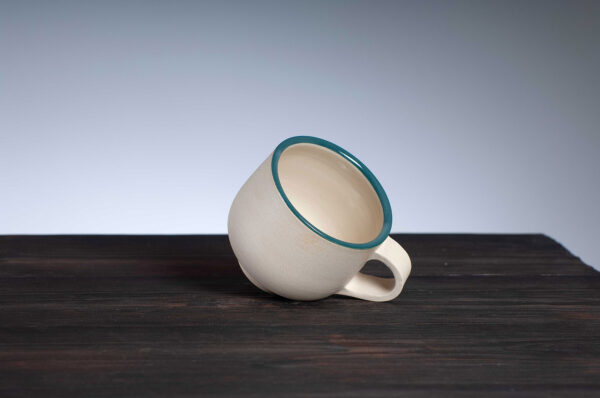 top view of coffee cup with teal rim