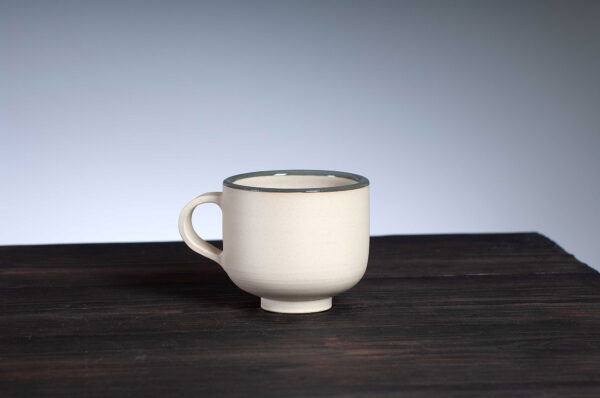 front view of coffee cup with grey rim