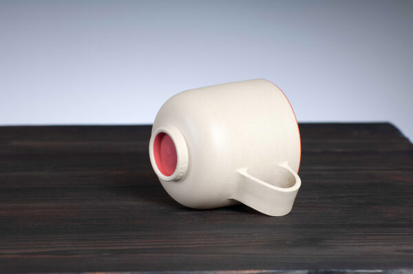 bottom view of stoneware mug with red rim