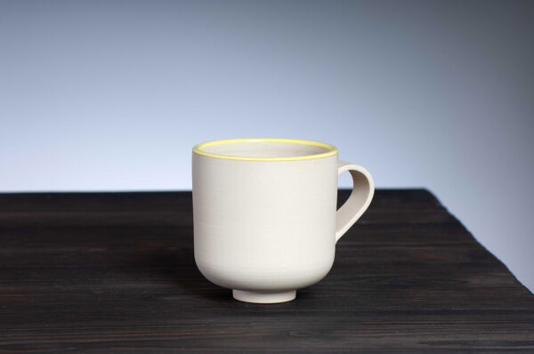 front view of stoneware mug with yellow rim